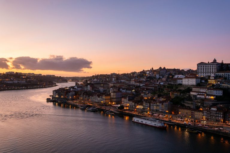 View to the beautiful city of Porto from D. Luis I bridge at sunset
